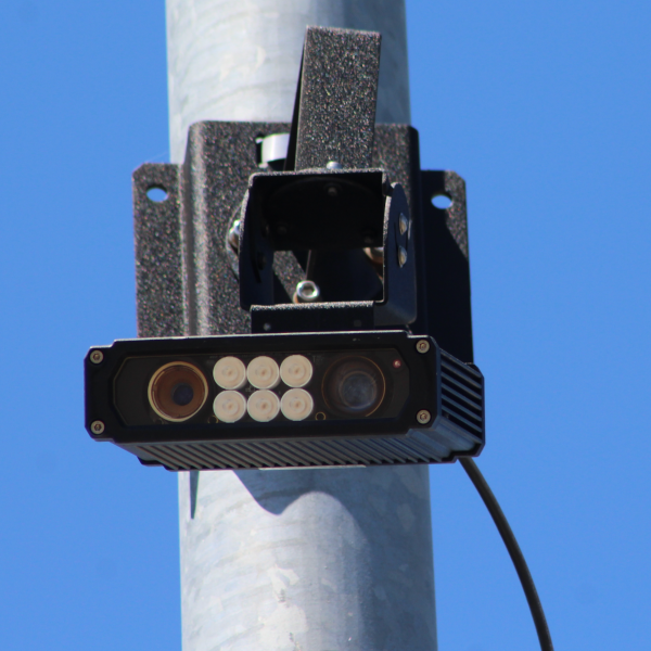 Vigilant brand automatic license plate reader affixed to a light pole