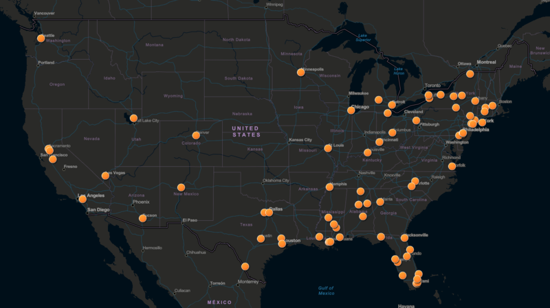 A map of the United States with small, orange circles representing real-time crime centers.